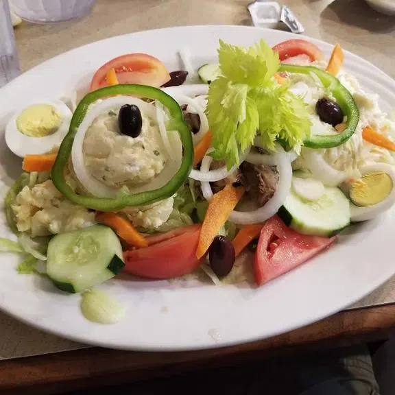 Fresh mixed garden salad with vegetables and olives