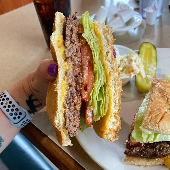 Club sandwich with bacon, lettuce, tomato and coleslaw